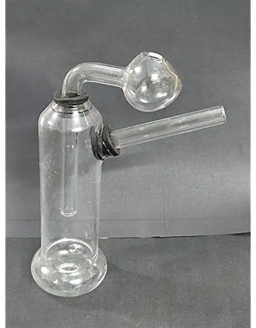 image of a glass meth bong pipe sitting on a table