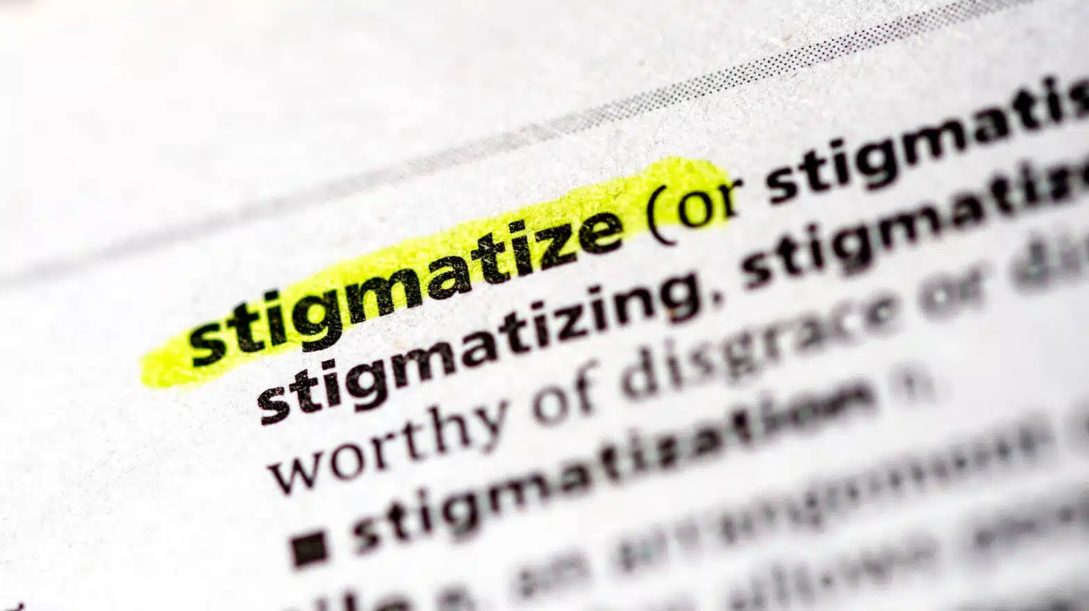 A dictionary page defining "stigmatize", the word stigmatize is highlighted - Common Myths About Substance Use Disorders