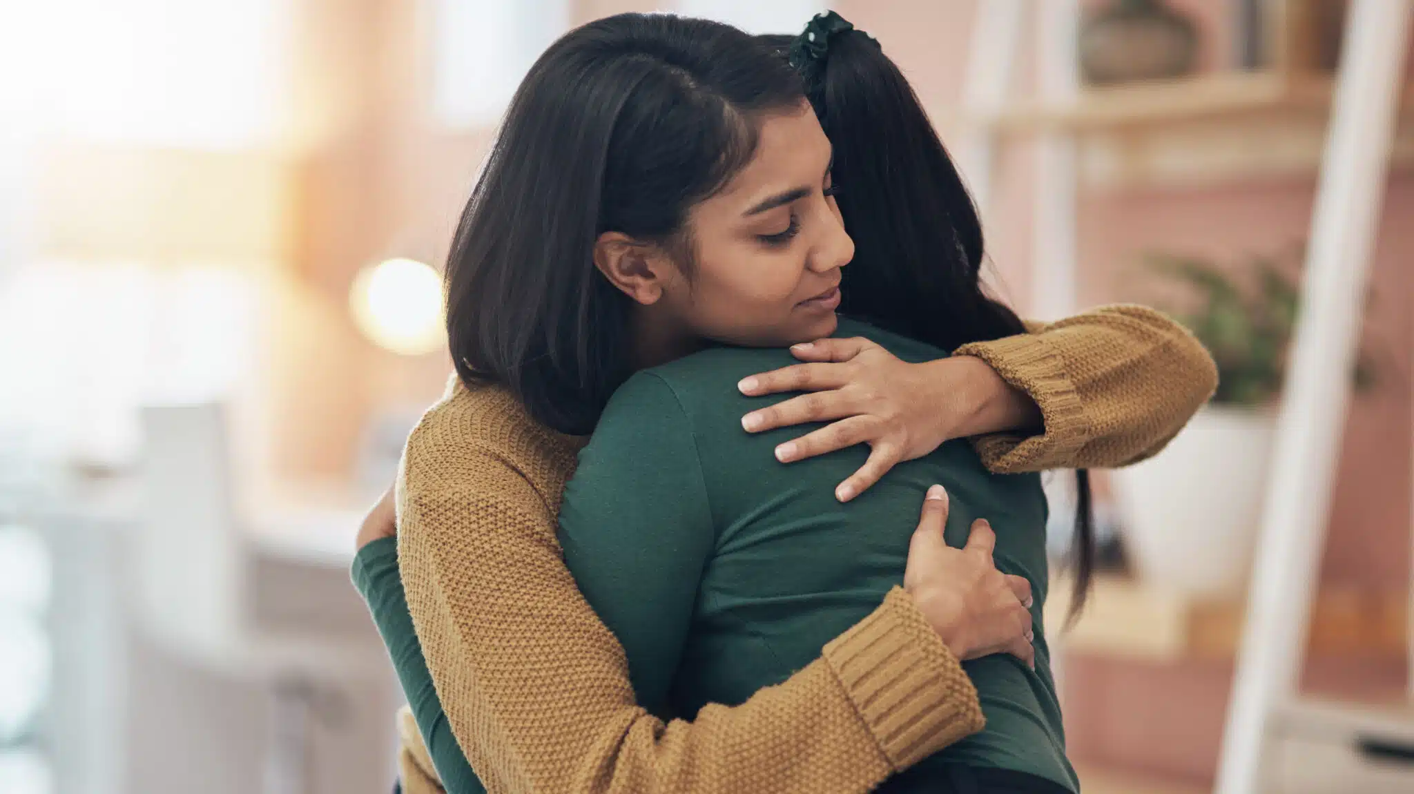 Two women hug - Rebuilding Damaged Relationships After Rehab