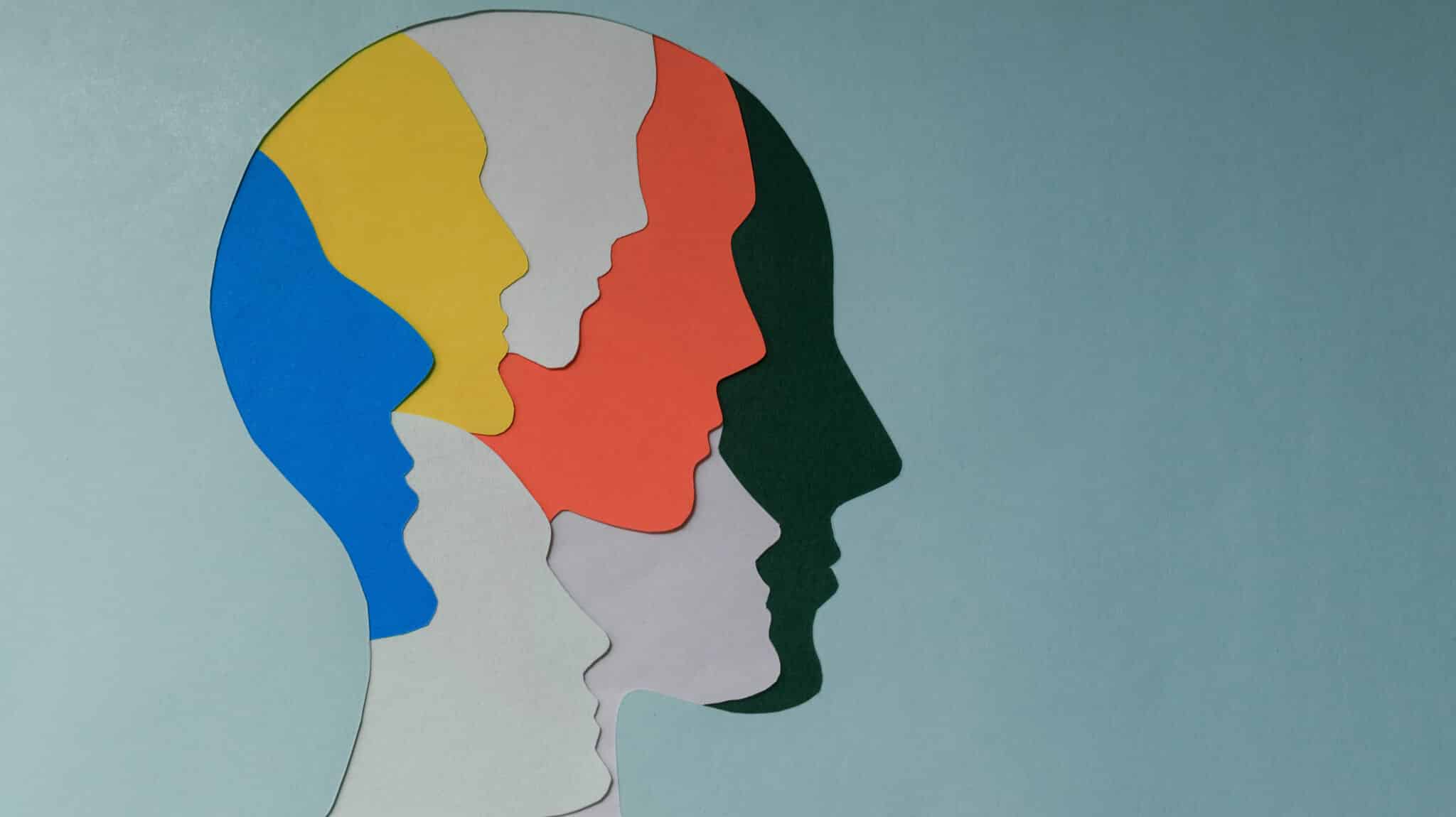 A silhouette of a head with smaller multi colored silhouette heads inside of it - Internal Family Systems Therapy For Mental Illness At Bedrock