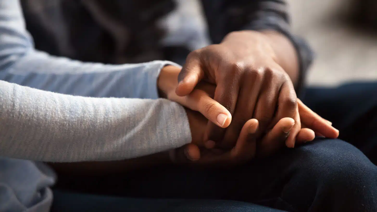 A couple holds hands - What To Expect When A Loved One Goes To Rehab