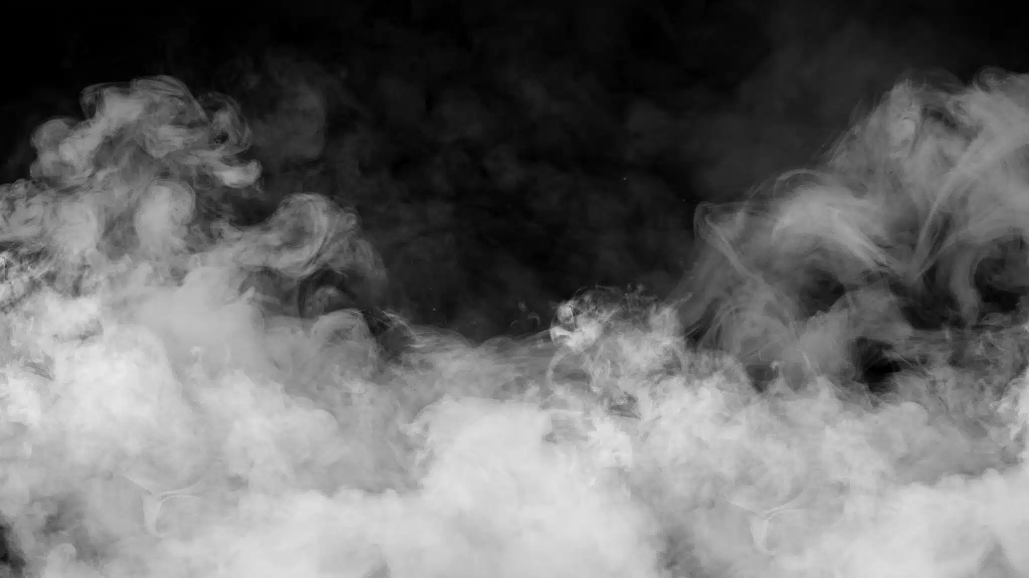 Smoke on a black background - What Is Hotboxing Is It Dangerous